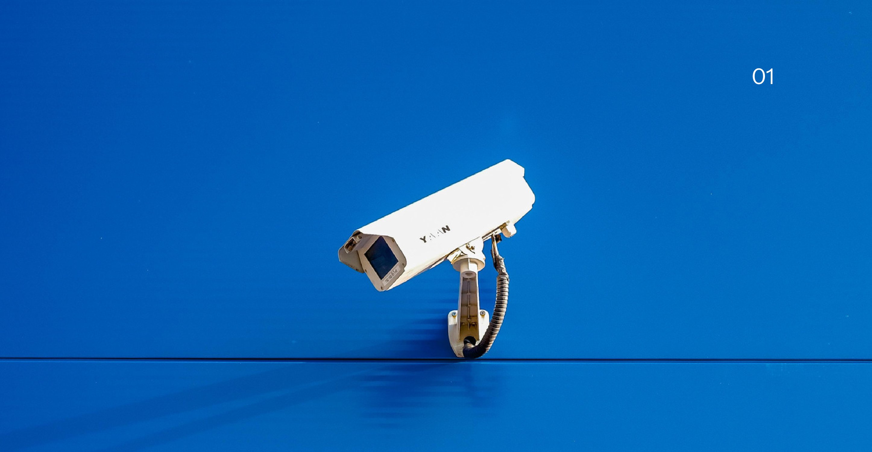 Security camera on a blue wall